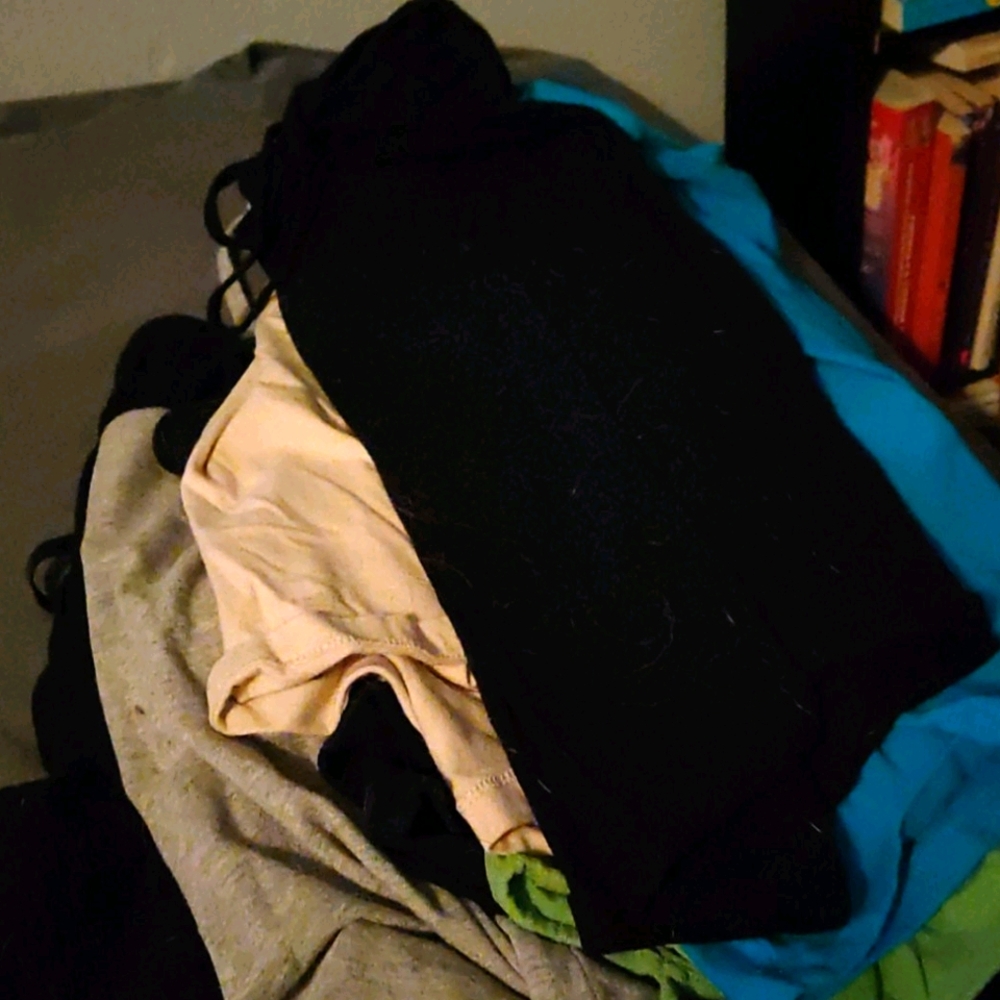 Several tank tops of multi color